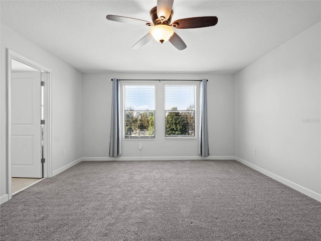 unfurnished room with light carpet, a textured ceiling, and ceiling fan