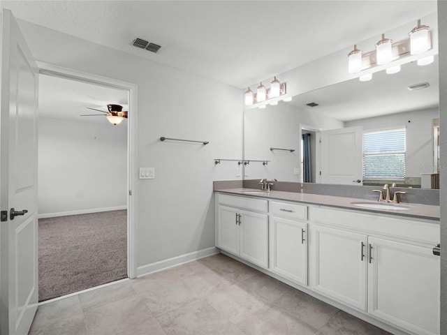 bathroom with ceiling fan and vanity