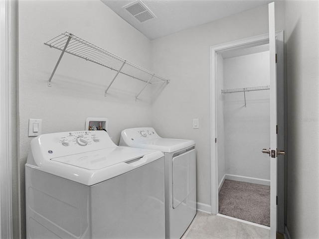 laundry room featuring independent washer and dryer