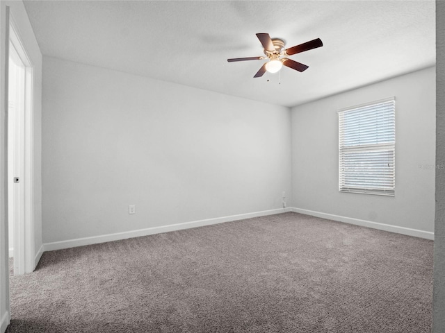 unfurnished room with carpet floors and ceiling fan