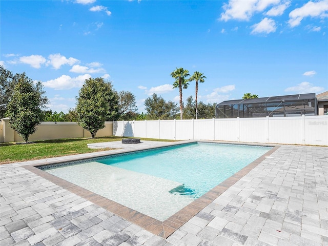 view of pool featuring an outdoor fire pit and a patio area