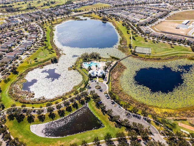 birds eye view of property with a water view