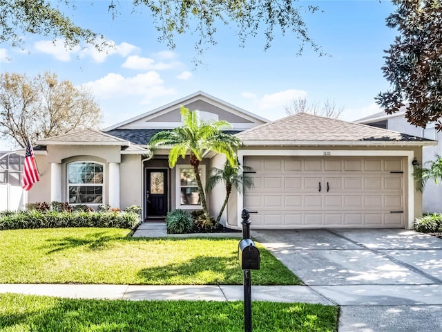 ranch-style home with a garage and a front yard