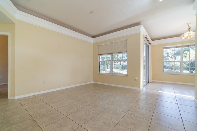 empty room featuring ornamental molding and light tile patterned floors