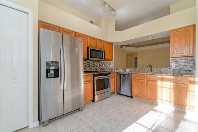 kitchen with appliances with stainless steel finishes, visible vents, backsplash, and light tile patterned flooring