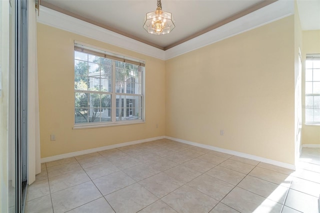 unfurnished room featuring crown molding, light tile patterned floors, and an inviting chandelier