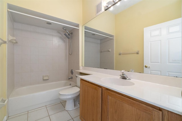 full bathroom with vanity, toilet, tiled shower / bath combo, and tile patterned flooring