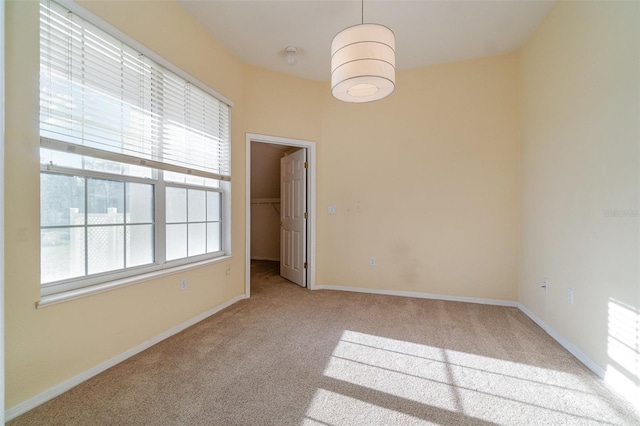 spare room with light colored carpet