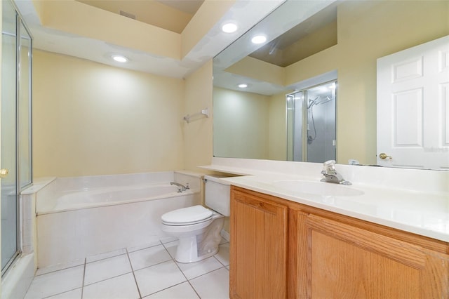 bathroom featuring tile patterned floors, toilet, a shower with shower door, vanity, and a bath