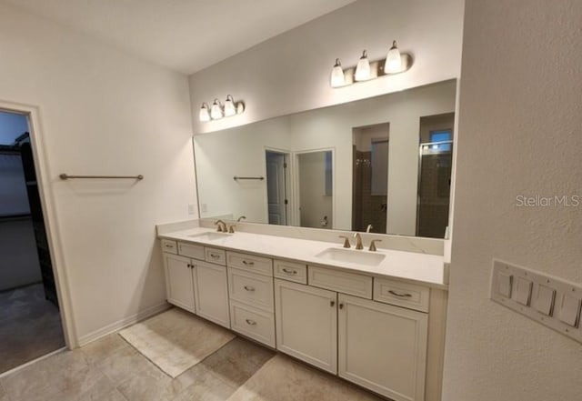 bathroom featuring vanity and a shower with door