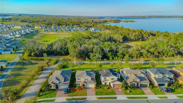 bird's eye view featuring a water view and a residential view