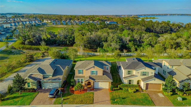 bird's eye view with a water view and a residential view