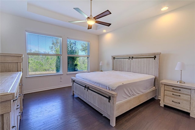 bedroom with a ceiling fan, baseboards, dark wood-type flooring, and recessed lighting