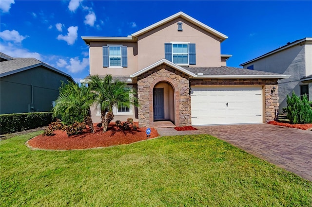 traditional home with stone siding, decorative driveway, and stucco siding