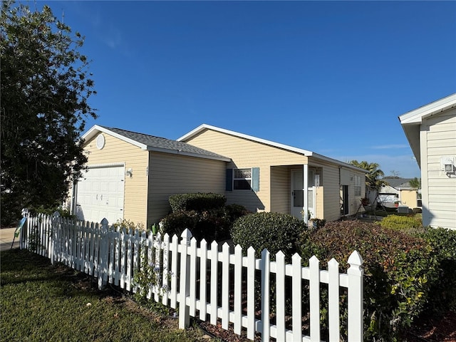 view of side of home with a garage