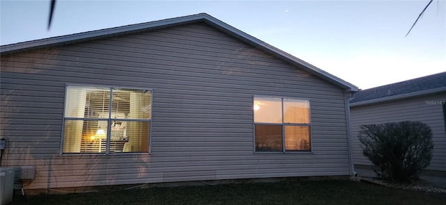 view of property exterior at dusk