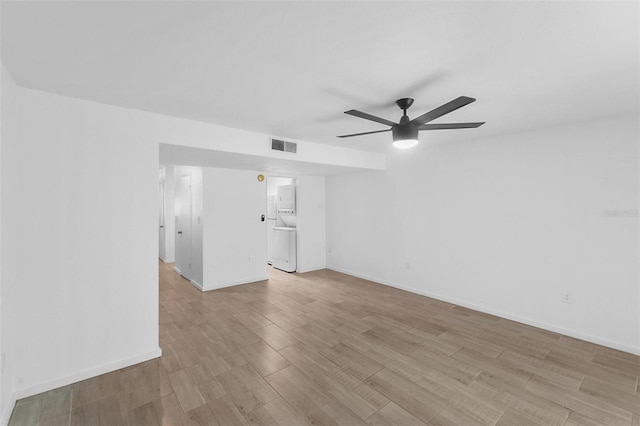 empty room featuring ceiling fan and light wood-type flooring