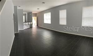 spare room featuring dark hardwood / wood-style flooring