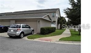 view of side of home with a garage