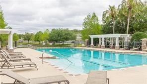 view of swimming pool featuring a patio area