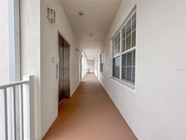 hallway featuring elevator