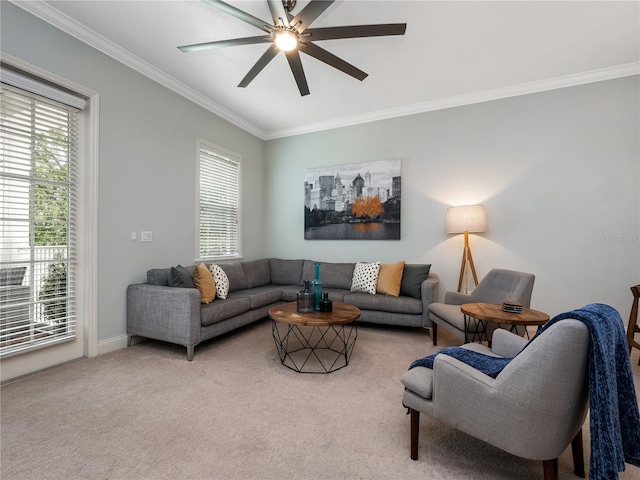 living room with ceiling fan, ornamental molding, plenty of natural light, and carpet floors