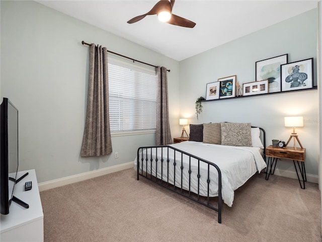 bedroom with light colored carpet and ceiling fan