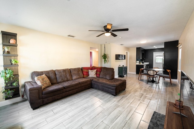 living room with ceiling fan