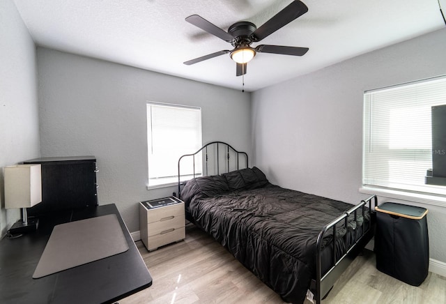 bedroom featuring ceiling fan and light wood-type flooring