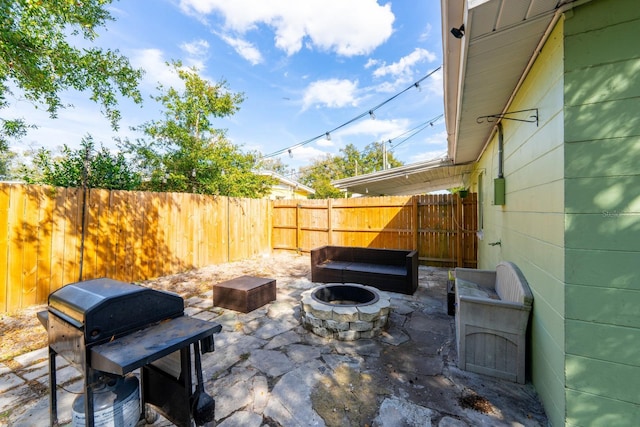 view of patio / terrace with area for grilling and a fire pit