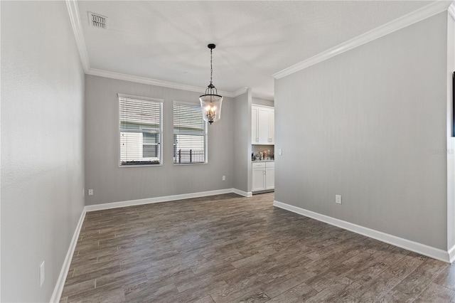 4608 Egg Harbor Dr, Kissimmee, FL 34746 - unfurnished living room with crown molding, dark hardwood / wood-style flooring, and a notable chandelier