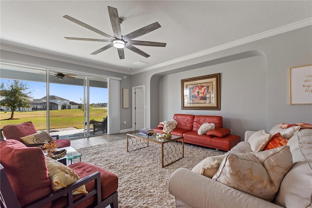 4608 Egg Harbor Dr, Kissimmee, FL 34746 - living room with crown molding, ceiling fan, hardwood / wood-style flooring, and a textured ceiling