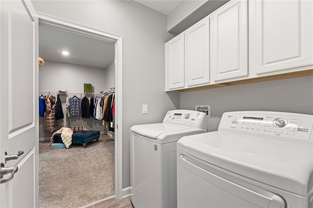 4608 Egg Harbor Dr, Kissimmee, FL 34746 - washroom with cabinets, light colored carpet, and washing machine and clothes dryer
