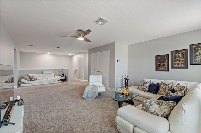 4608 Egg Harbor Dr, Kissimmee, FL 34746 - living room with ceiling fan, a textured ceiling, and carpet flooring