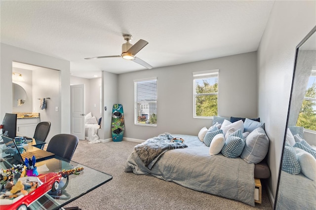 4608 Egg Harbor Dr, Kissimmee, FL 34746 - carpeted bedroom featuring ceiling fan, ensuite bathroom, and a textured ceiling