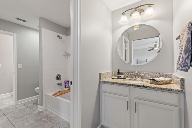 4608 Egg Harbor Dr, Kissimmee, FL 34746 - full bathroom featuring tiled shower / bath, vanity, ceiling fan, toilet, and tile patterned floors