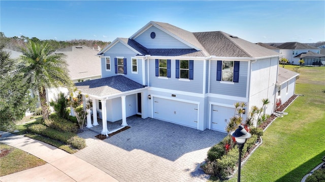 4608 Egg Harbor Dr, Kissimmee, FL 34746 - view of front facade featuring a garage and a front yard