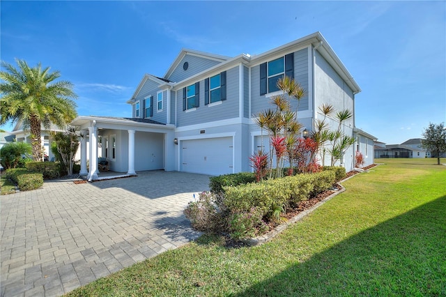 4608 Egg Harbor Dr, Kissimmee, FL 34746 - view of front of house with a garage and a front yard