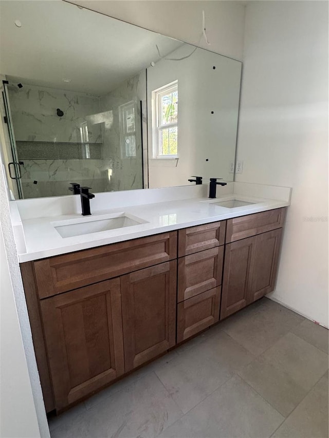 bathroom featuring vanity and tiled shower