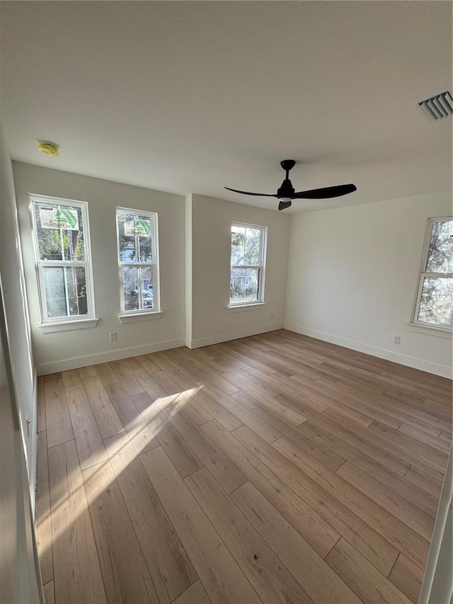 unfurnished room featuring light hardwood / wood-style flooring and ceiling fan