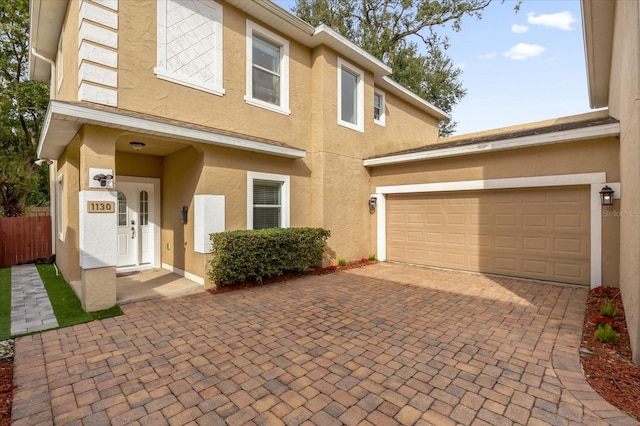 view of front of property with a garage