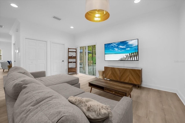 living room with light hardwood / wood-style flooring