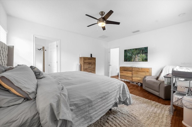 bedroom with dark wood-type flooring and ceiling fan