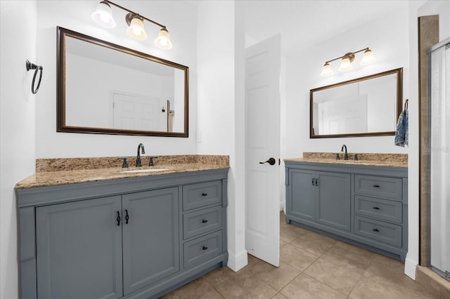 bathroom with tile patterned floors and vanity