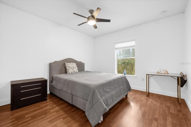 bedroom with hardwood / wood-style flooring and ceiling fan