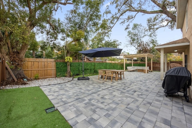 view of patio featuring a grill and a pergola