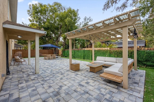 view of patio featuring an outdoor hangout area and a pergola