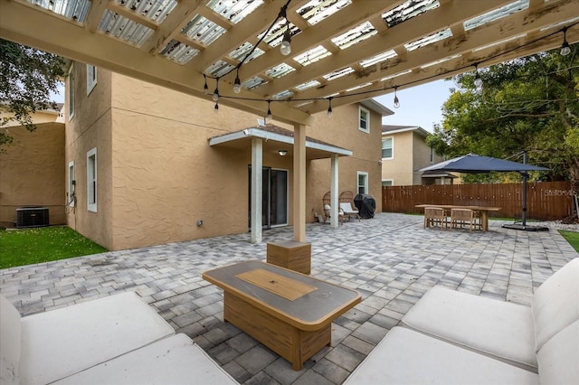 view of patio featuring a pergola and central AC