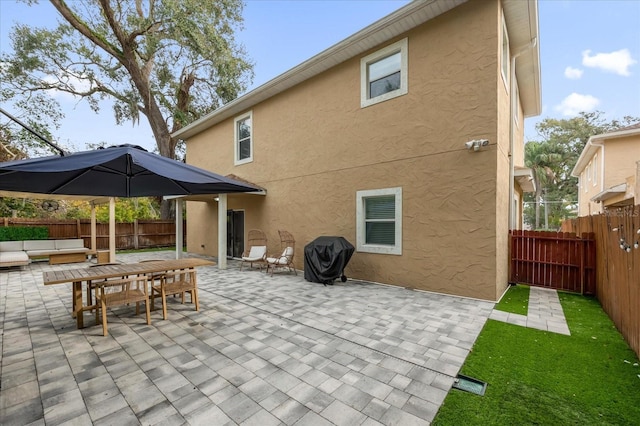 rear view of house featuring a patio