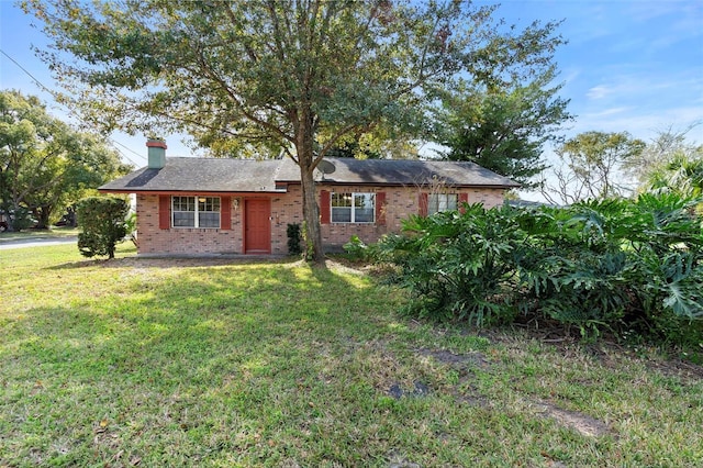 ranch-style house with a front lawn